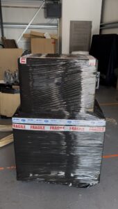 10K Used Gear secure packaging of pre-owned AV equipment with flight cases, pallets, and protective wrapping for safe worldwide shipping